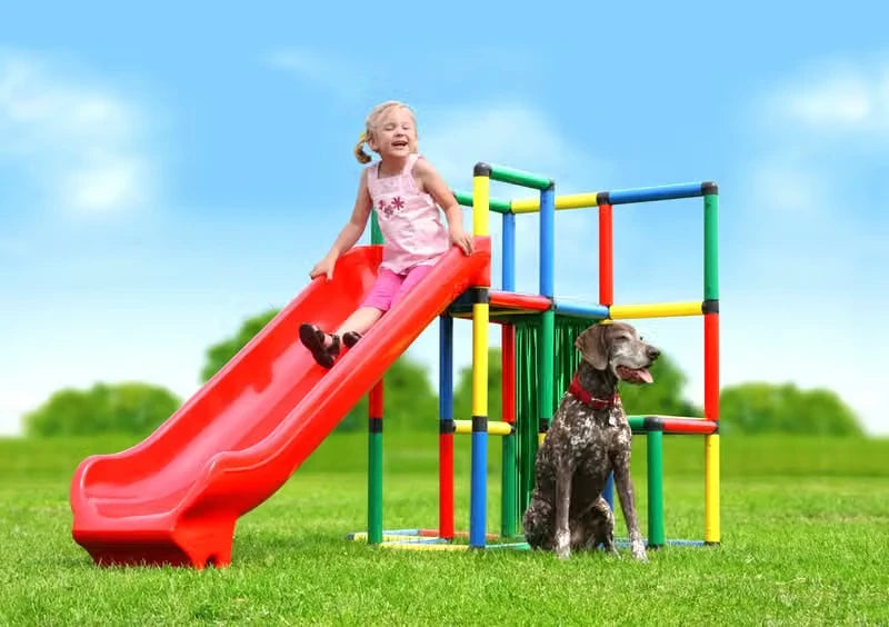 Child using a long red integrated slide attached to a QUADRO tower