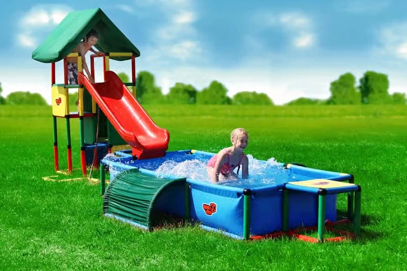 Covered QUADRO tower with red slide leading into an XXL pool with tunnel
